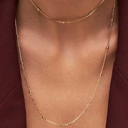 COLAR EM ELOS VAZADOS E COM ESFERAS LISAS