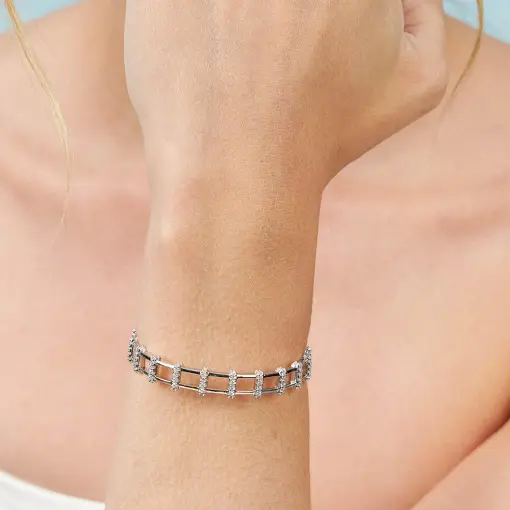 BRACELETE COM DEZESSETE FILEIRAS DE ZIRCÔNIAS PRATA RODINADA