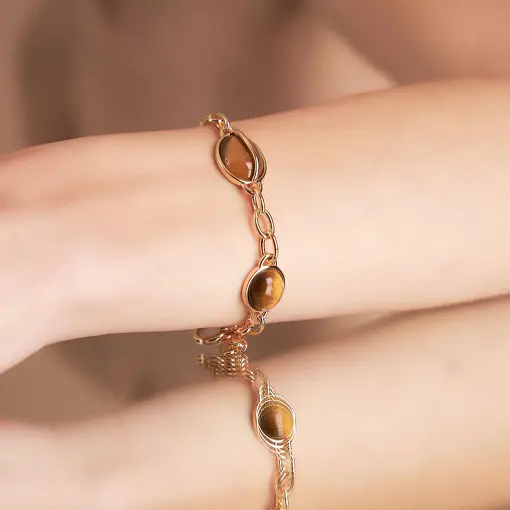 PULSEIRA COM CRISTAL OVAL E ELOS BANHADO A OURO
